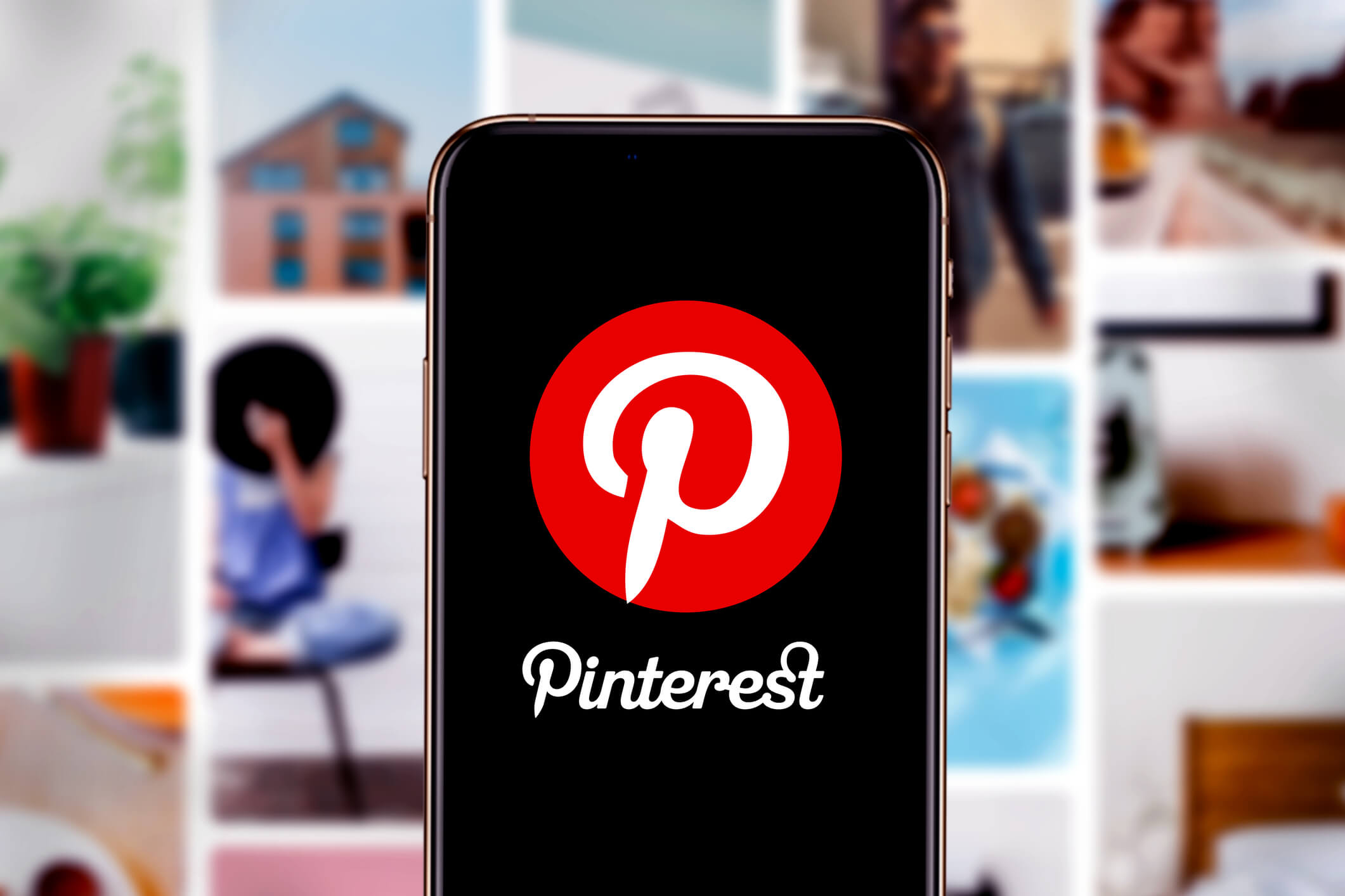 The Pinterest logo is displayed on a mobile phone with Pinterest boards in the background